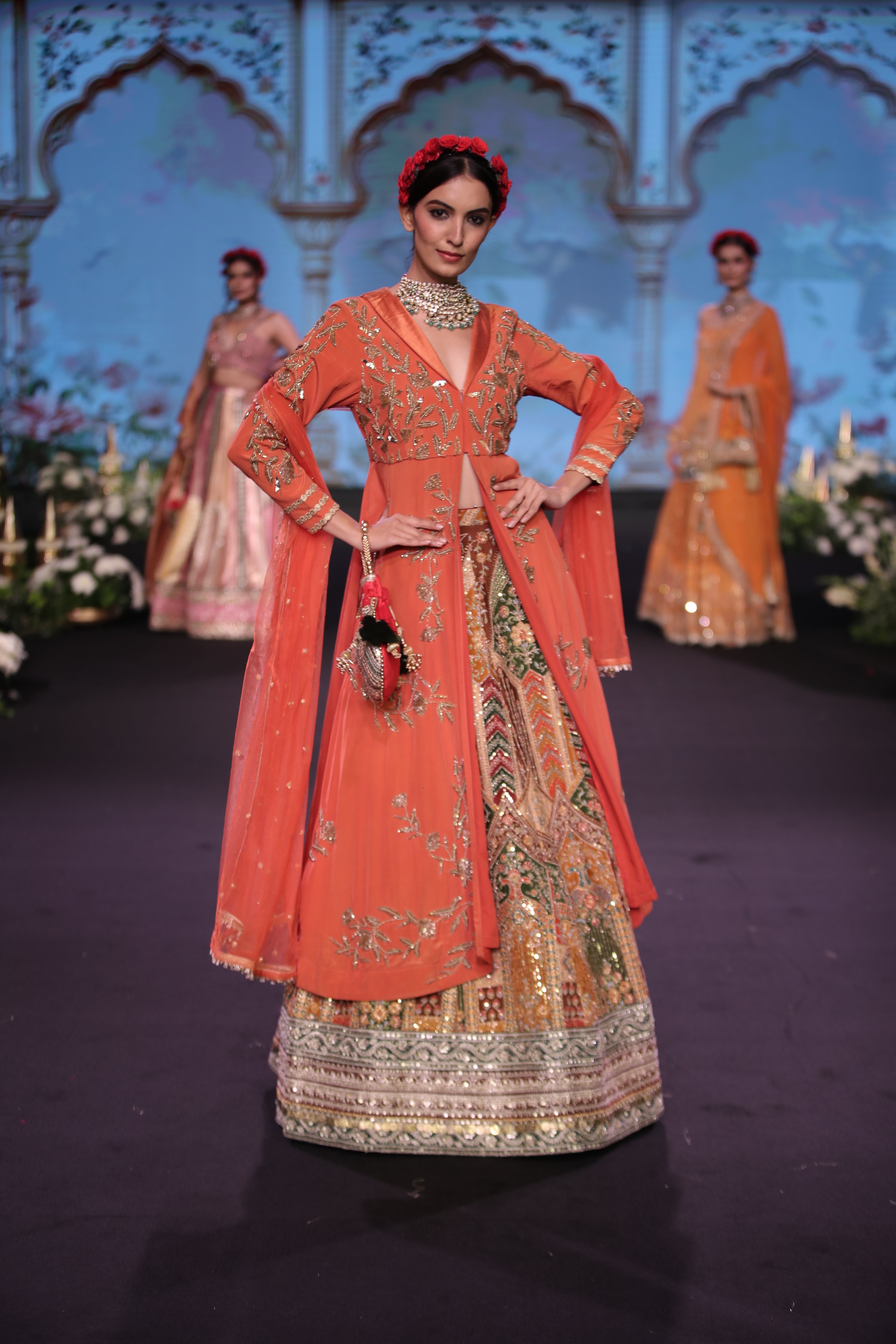 Orange kurta jacket and multi color embroidered lehenga set