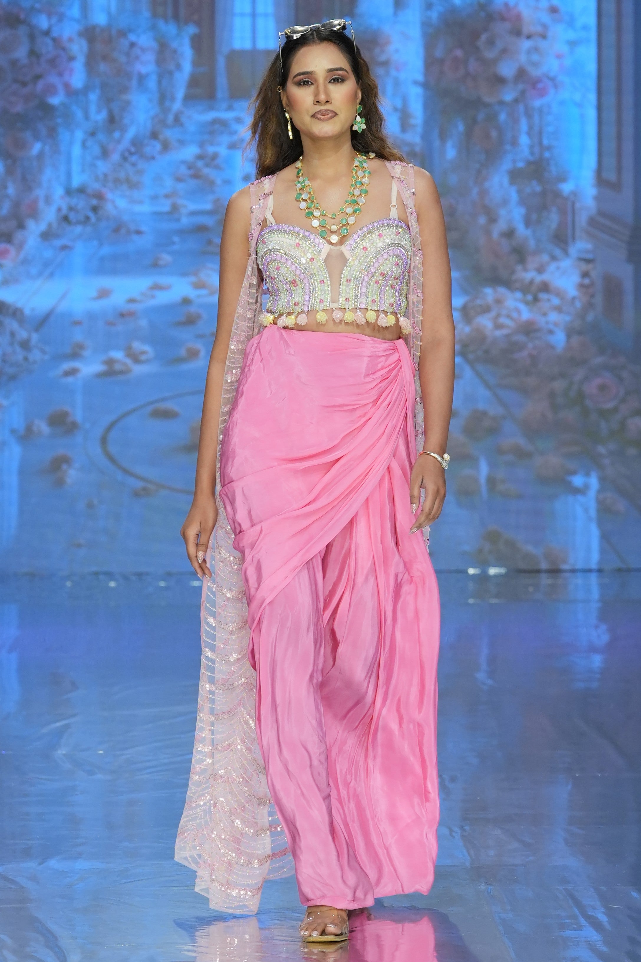 Pleated skirt with embroidered blouse and jacket