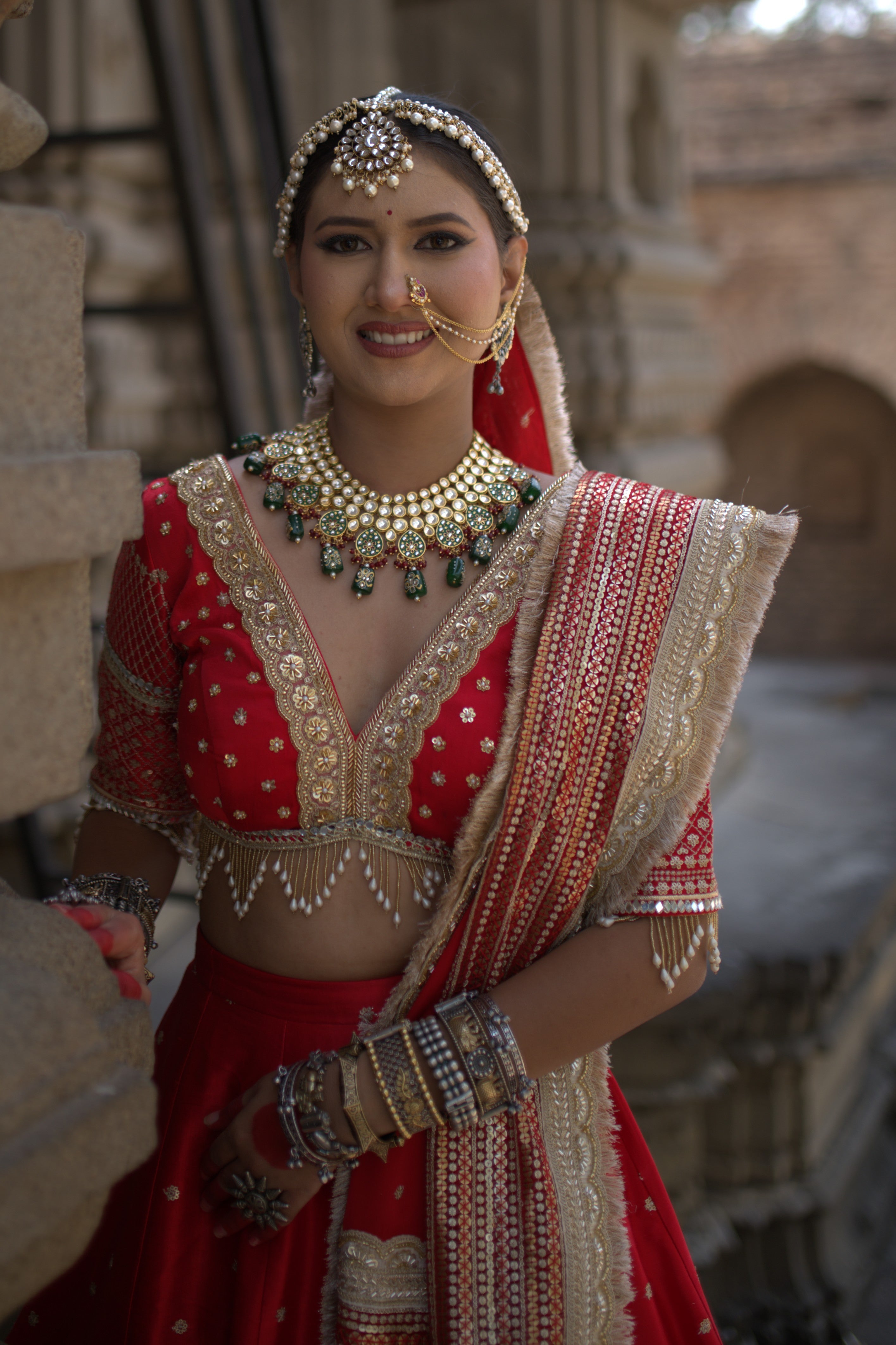 Red embroidered and applique work lehenga set
