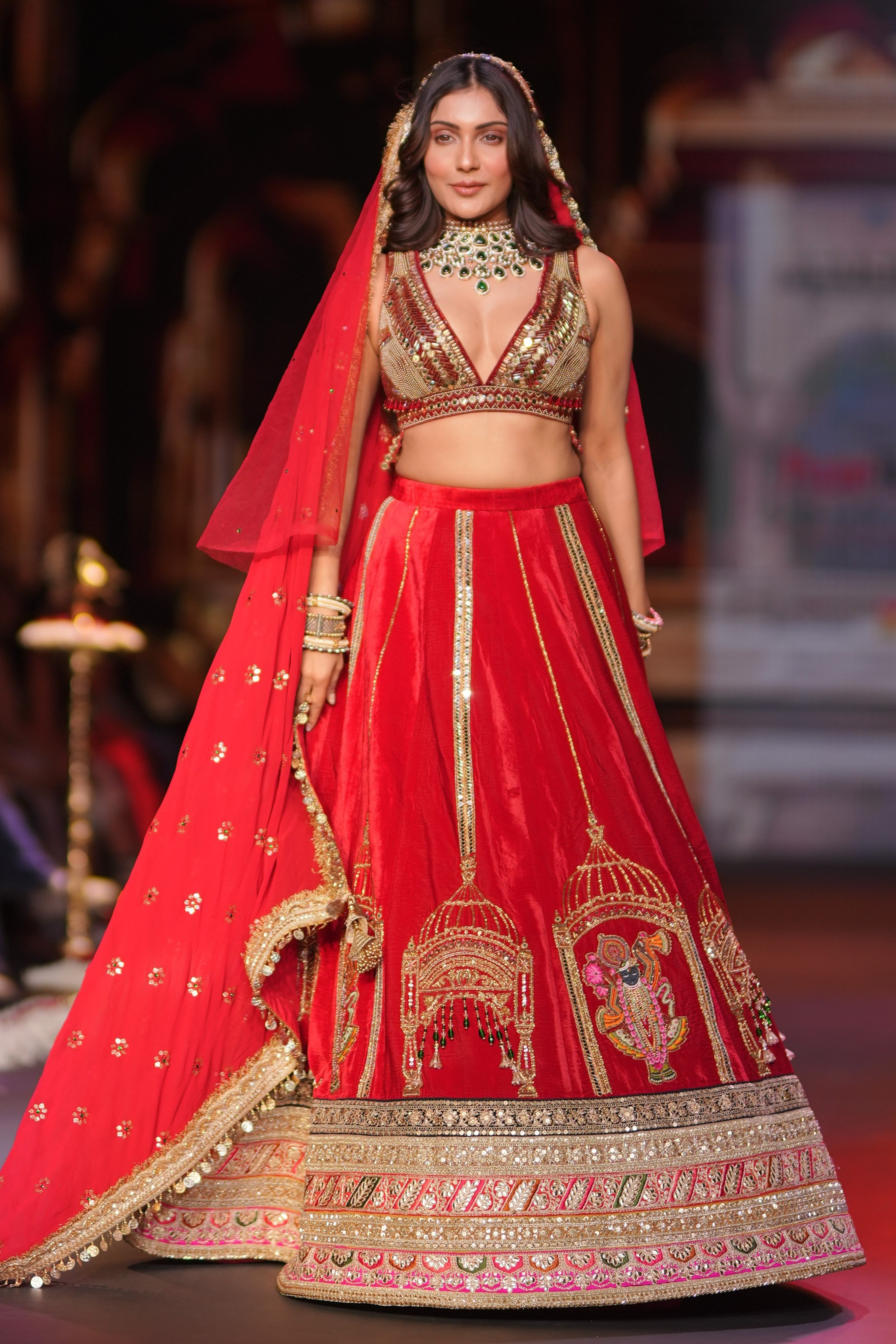 Red embroidered lehenga set with srinathji motif
