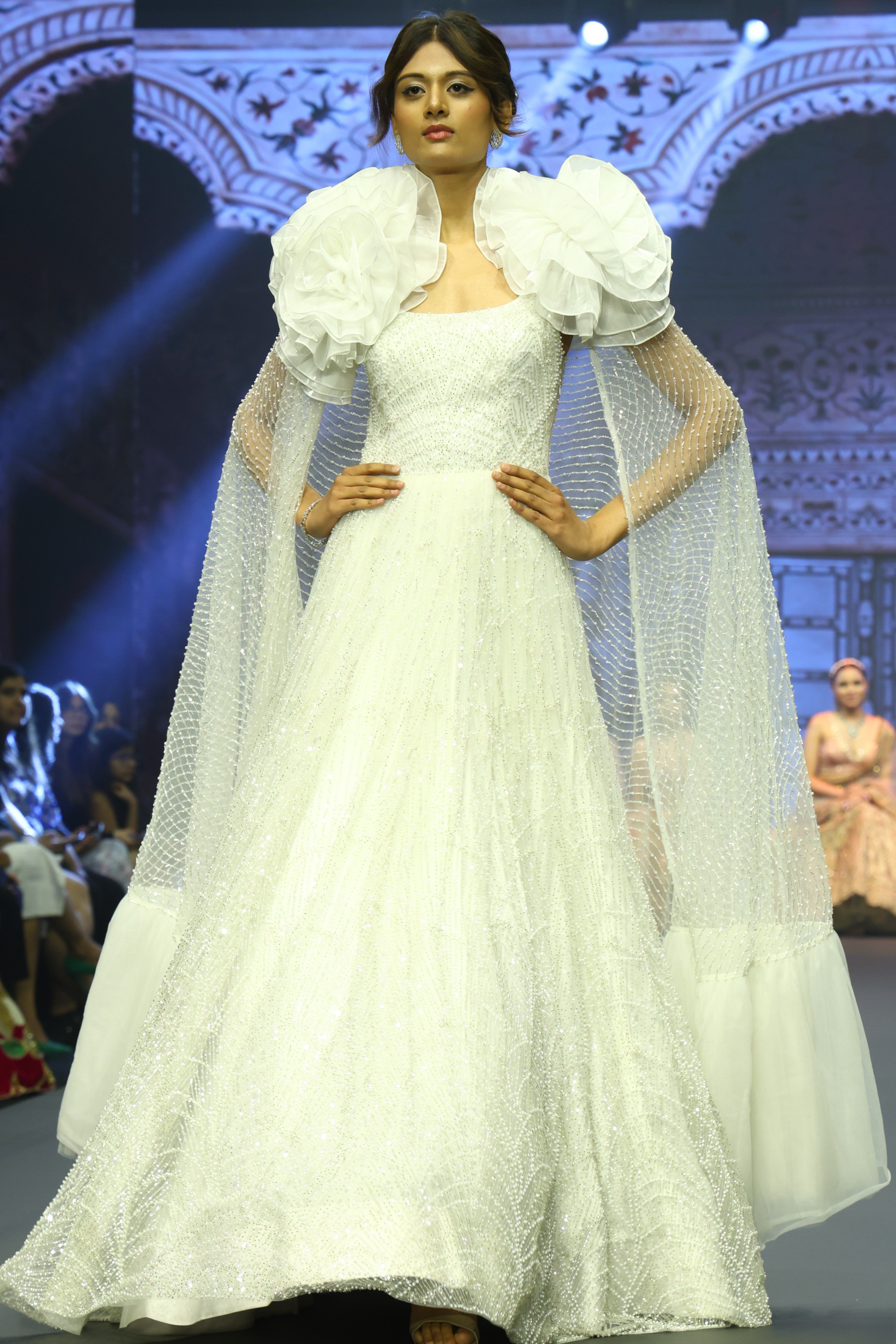 White embroidered gown with cape