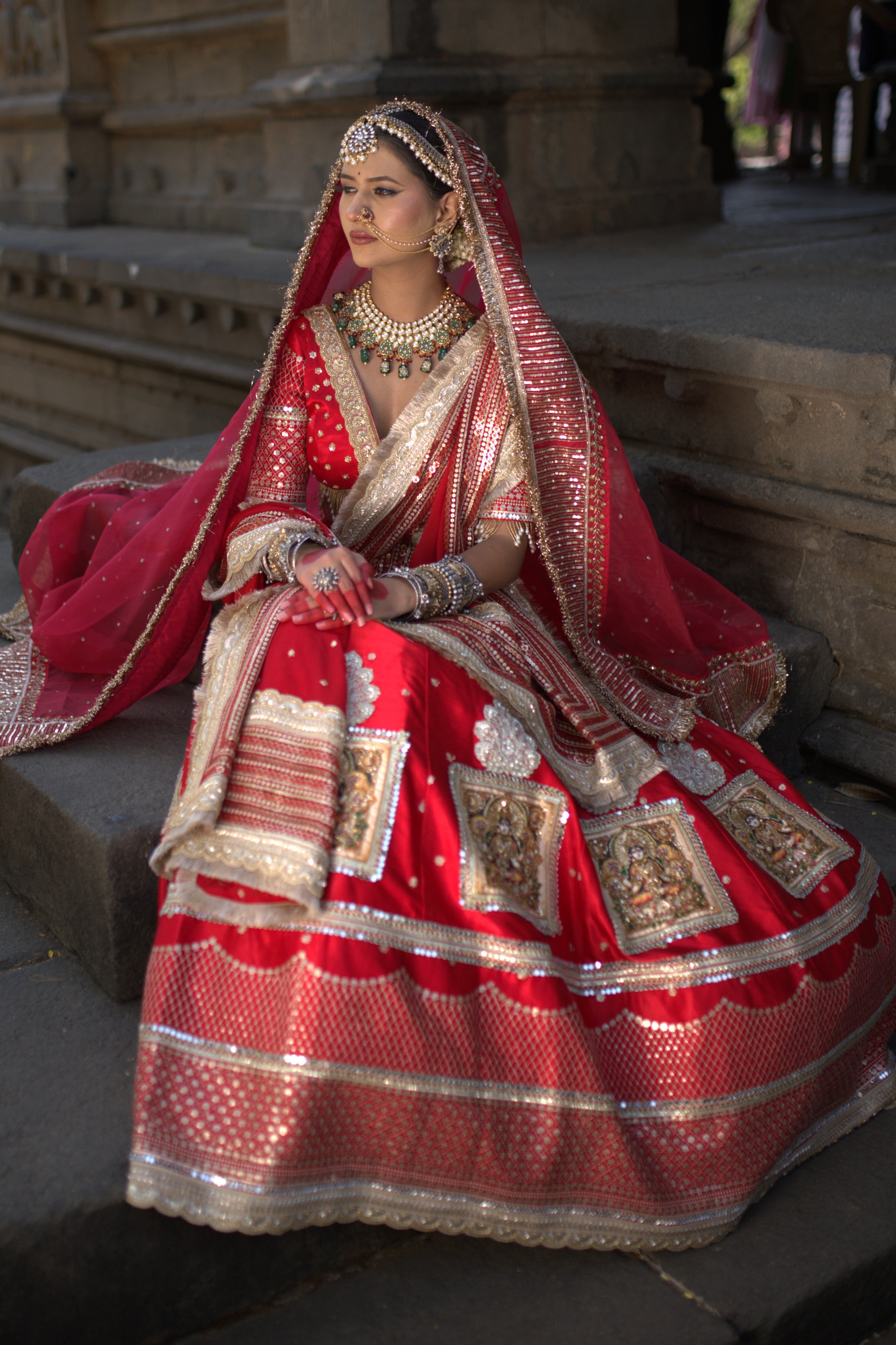 Red embroidered and applique work lehenga set