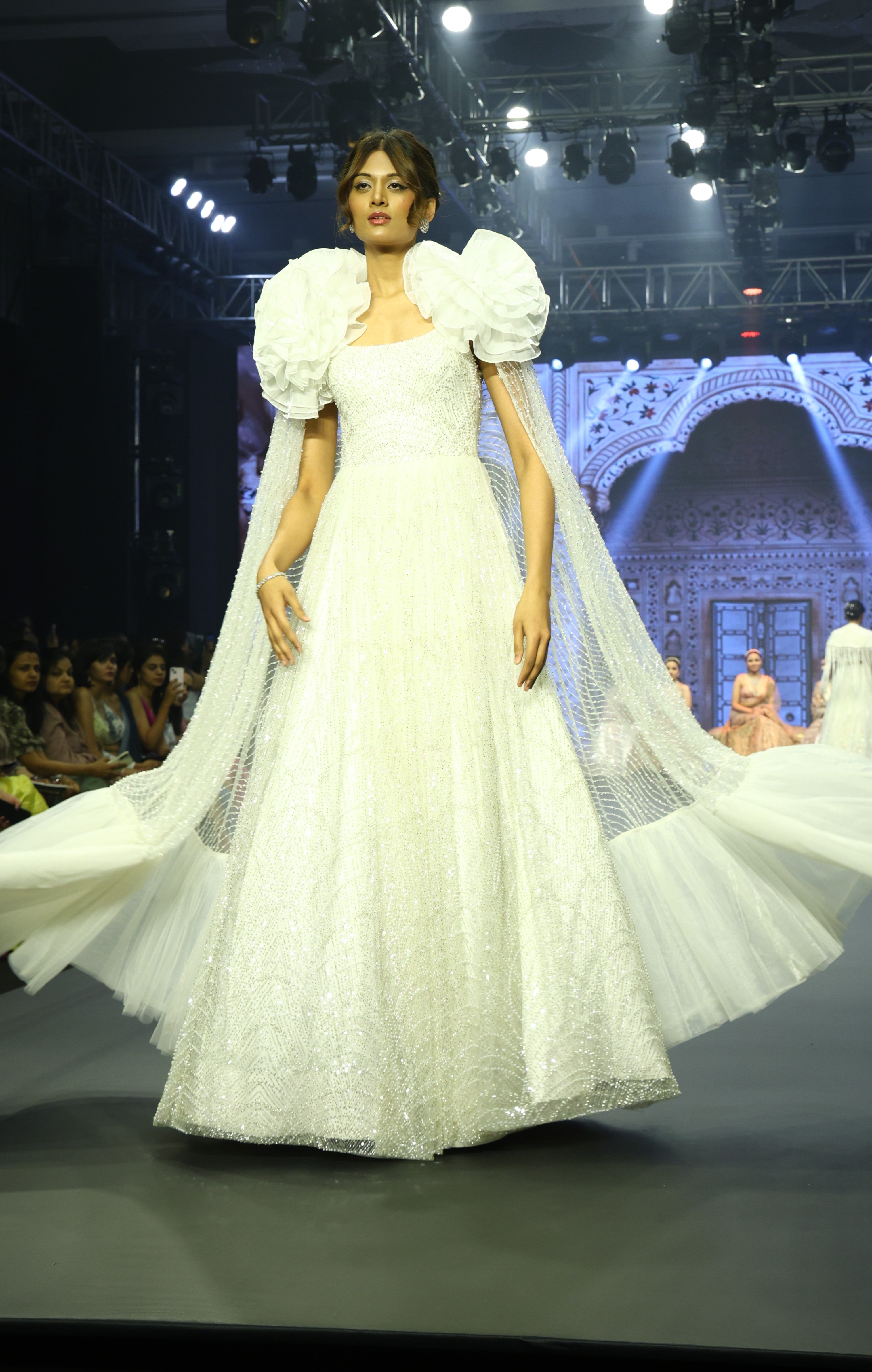 White embroidered gown with cape