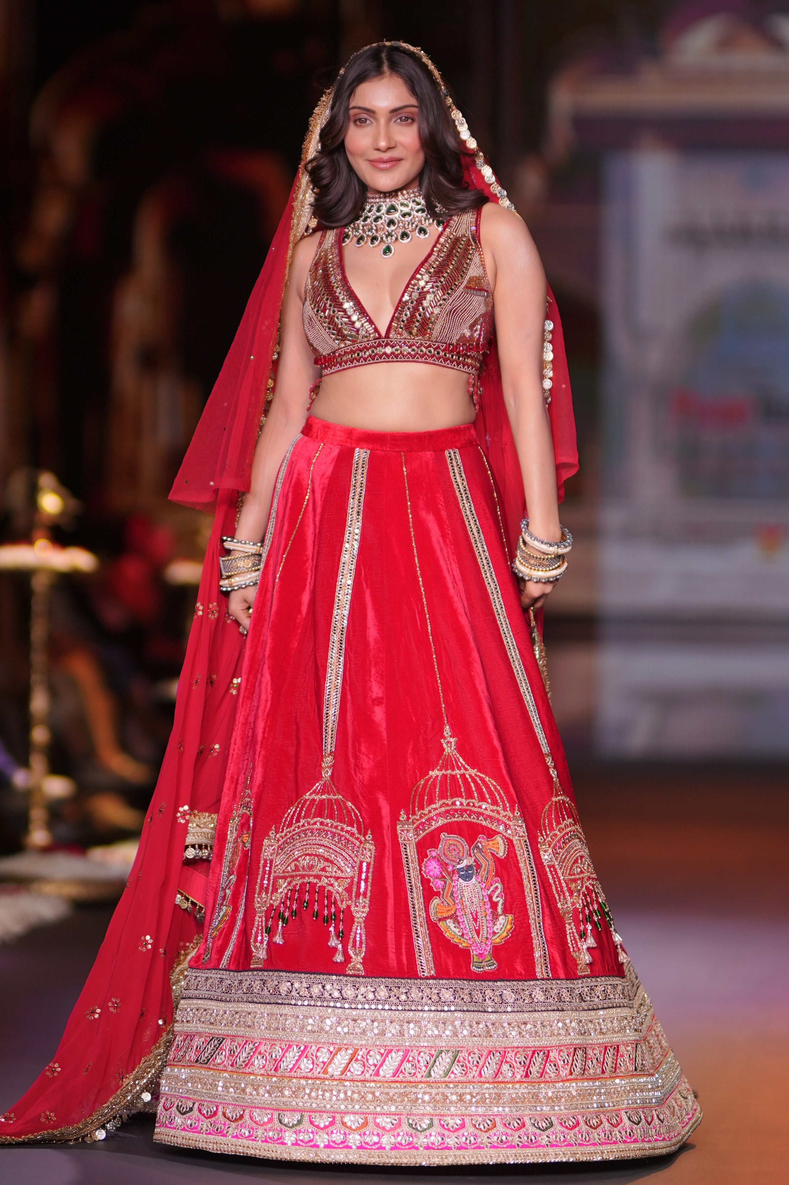 Red embroidered lehenga set with srinathji motif