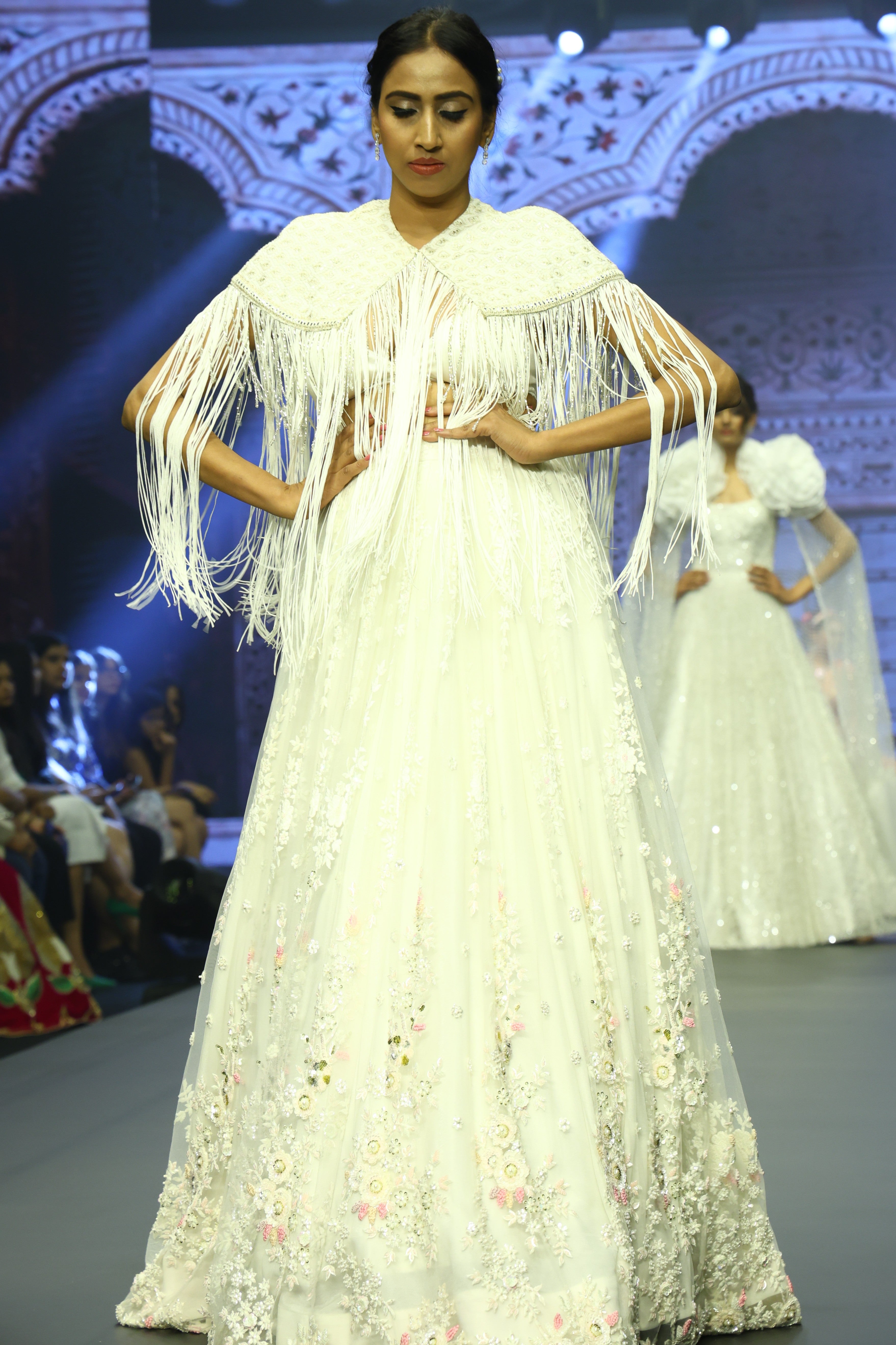 White sequin lehenga set with cape jacket