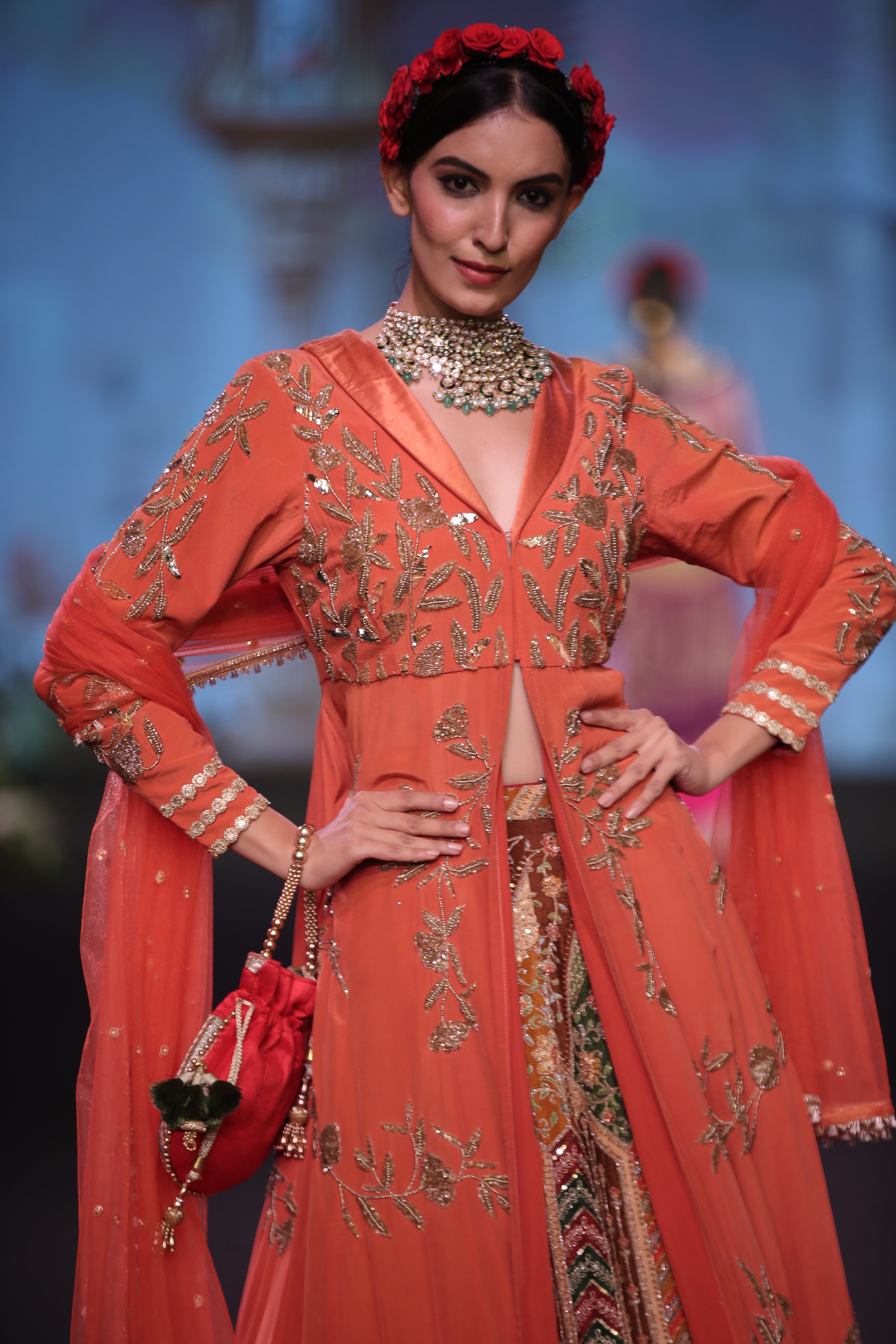 Orange kurta jacket and multi color embroidered lehenga set