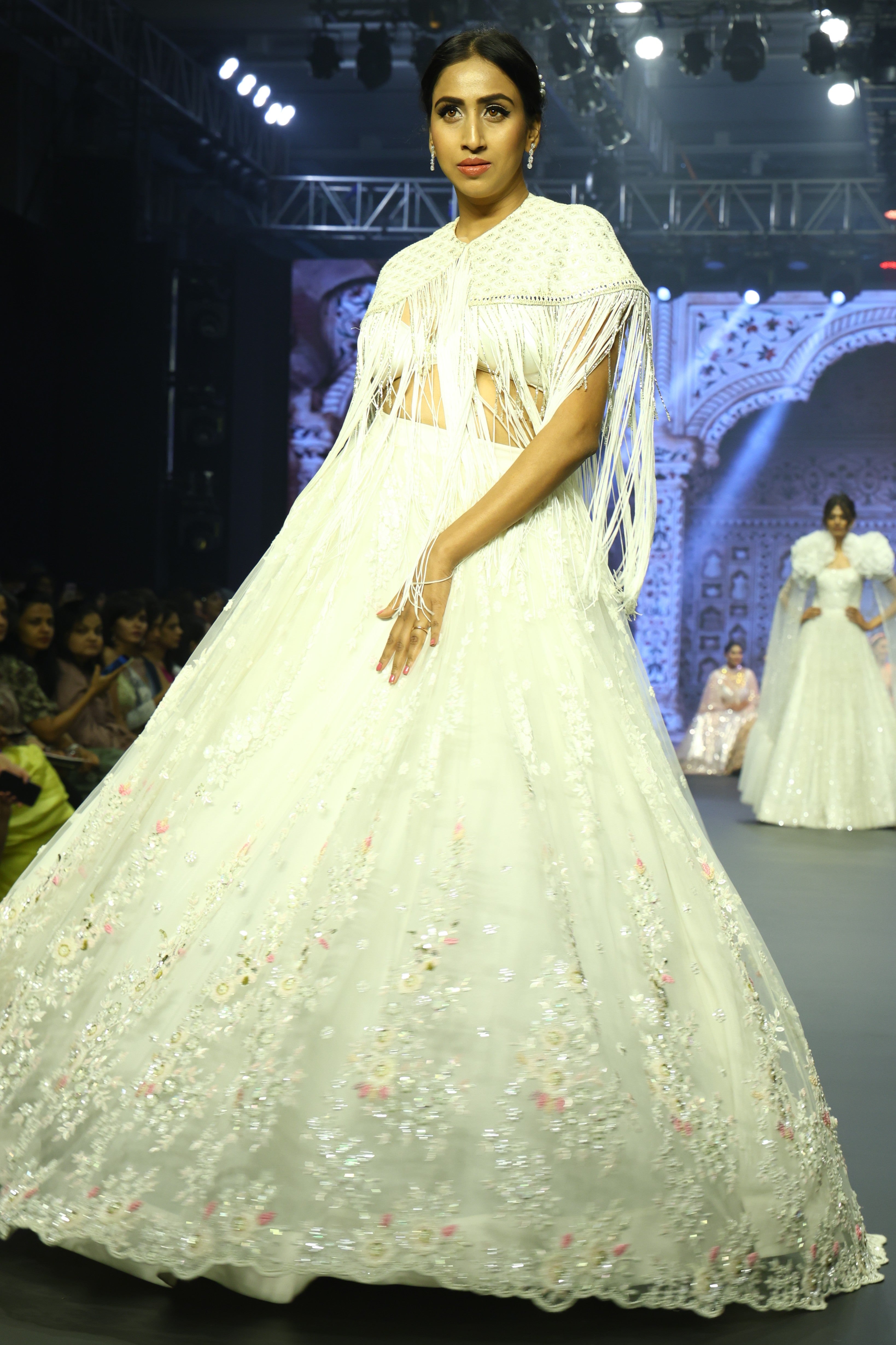 White sequin lehenga set with cape jacket