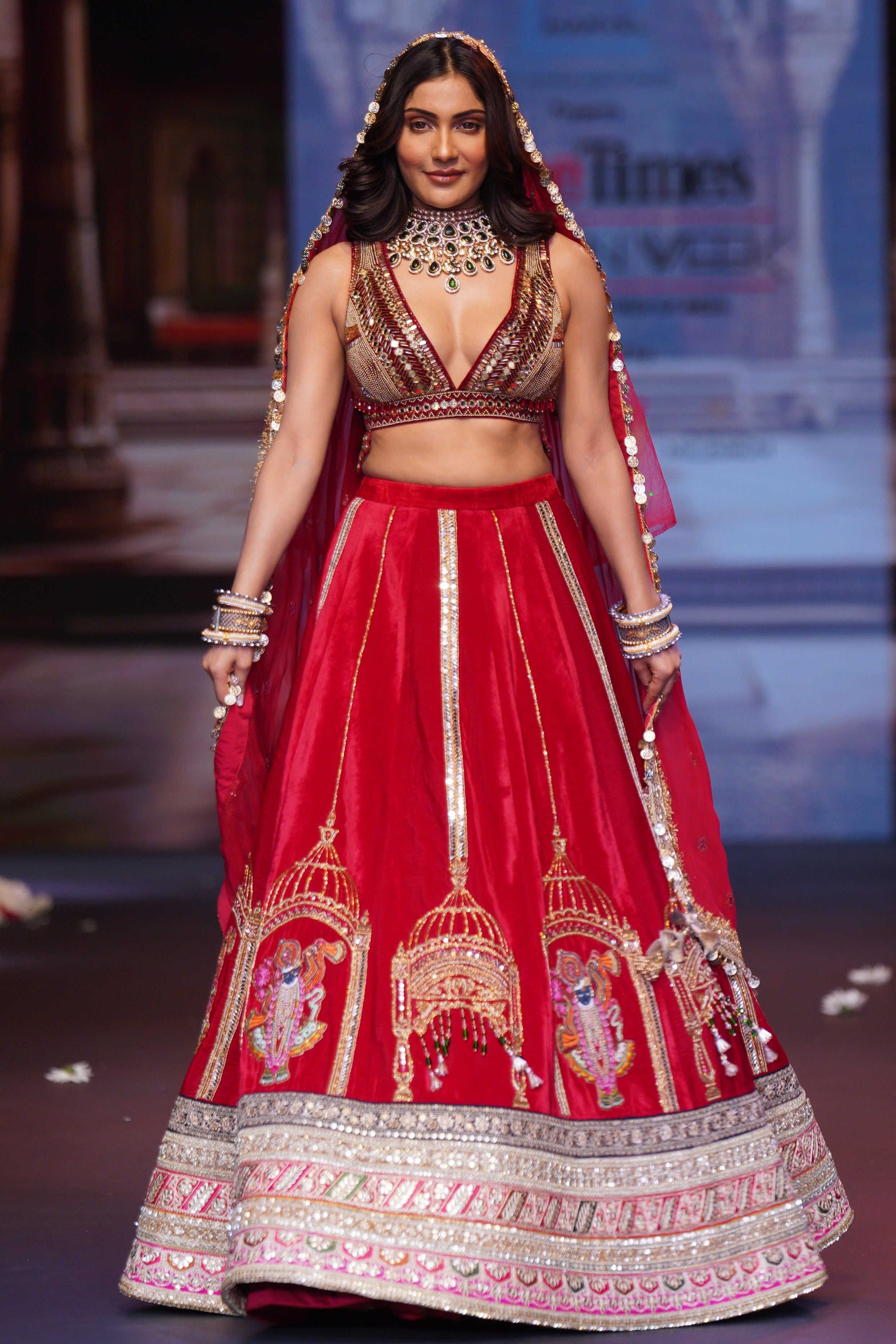 Red embroidered lehenga set with srinathji motif
