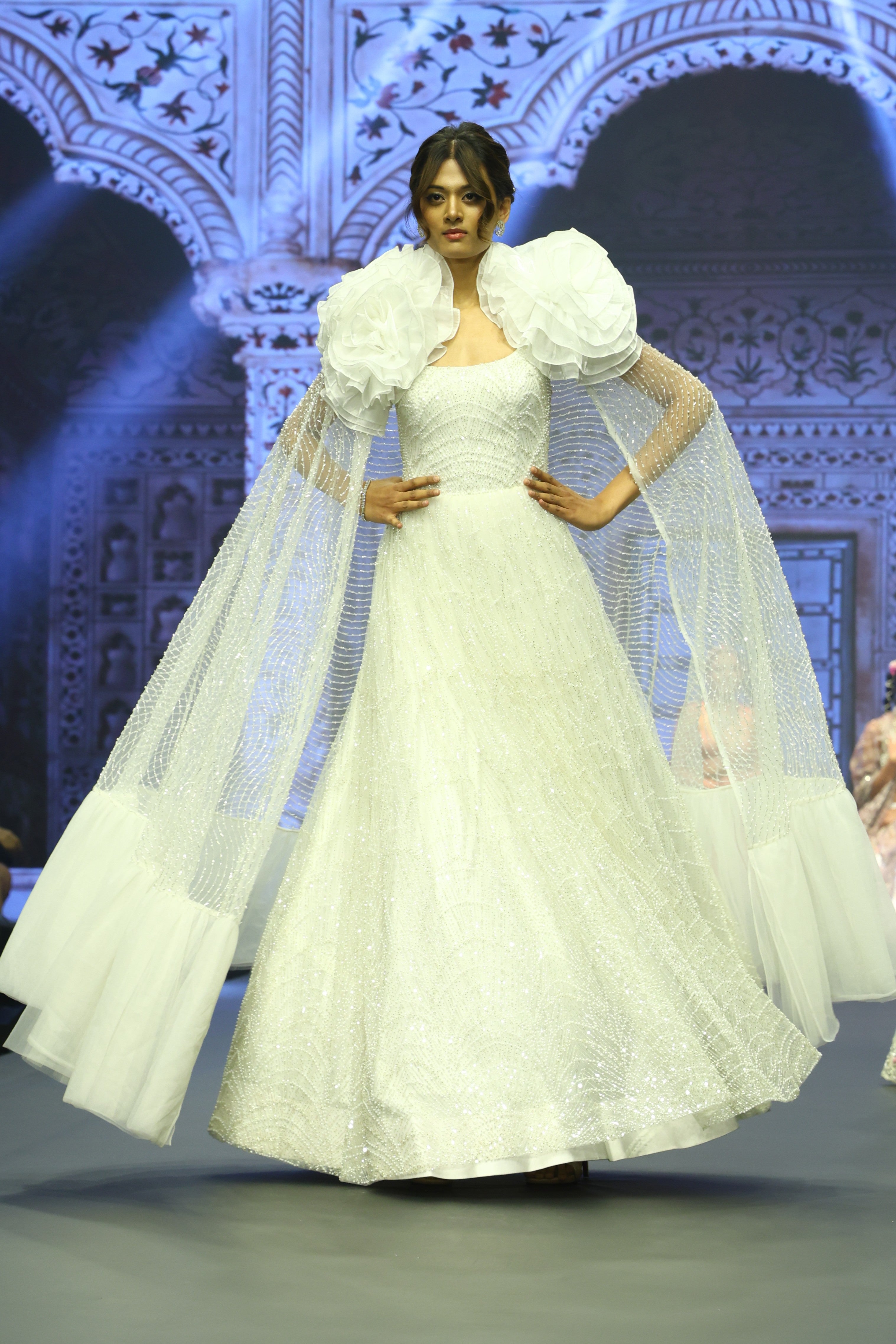 White embroidered gown with cape