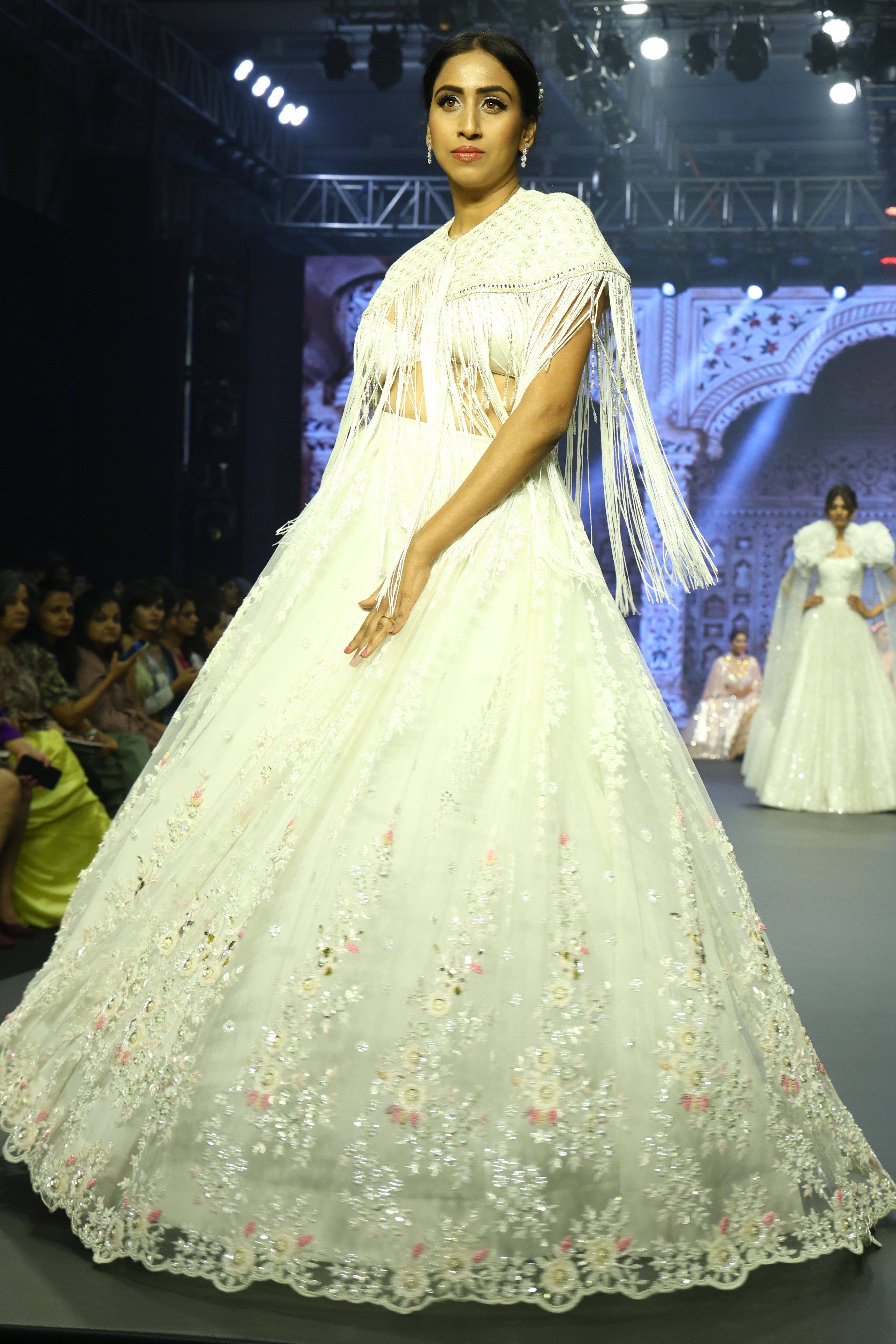 White sequin lehenga set with cape jacket