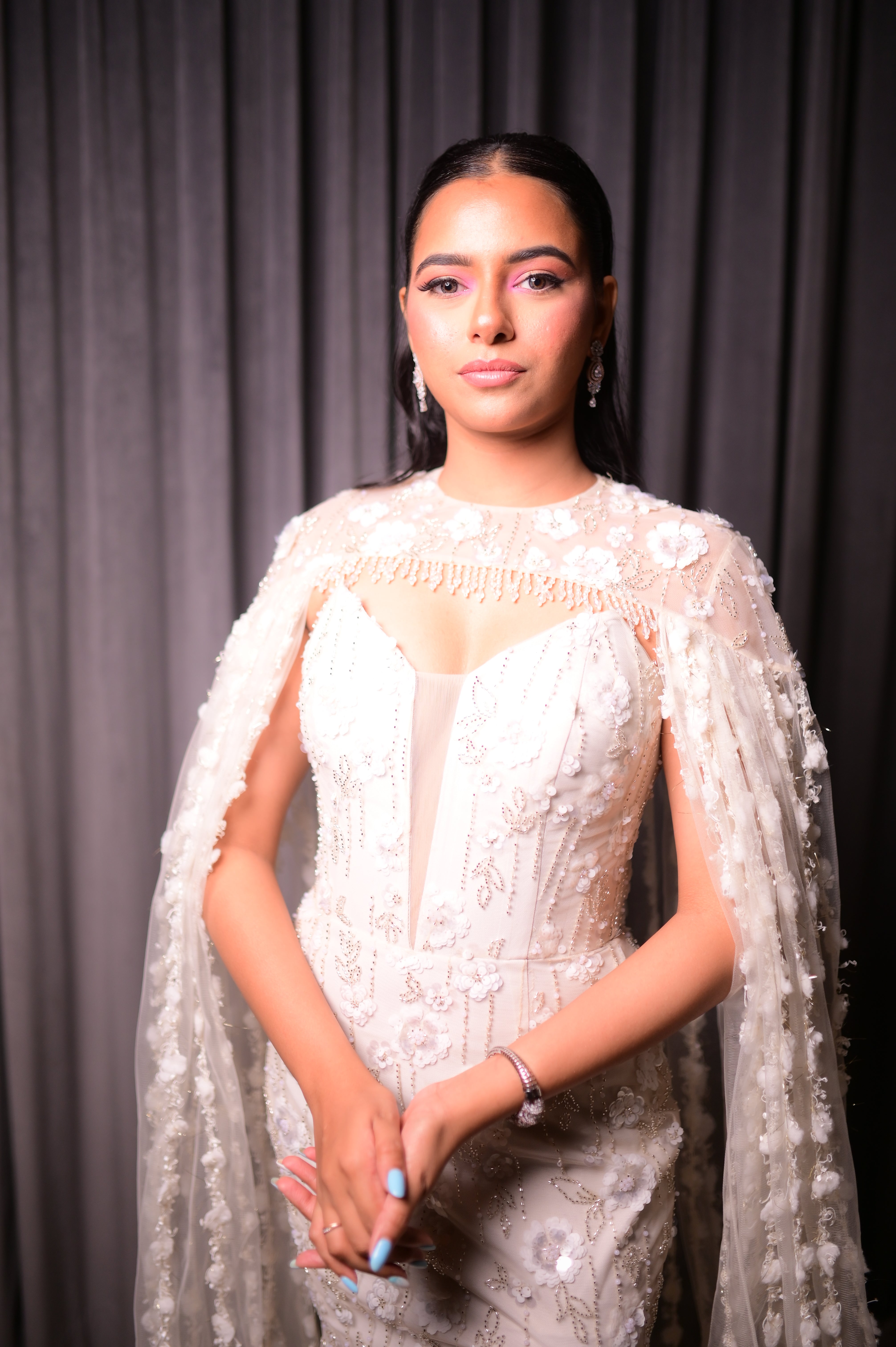 White sequin gown with cape