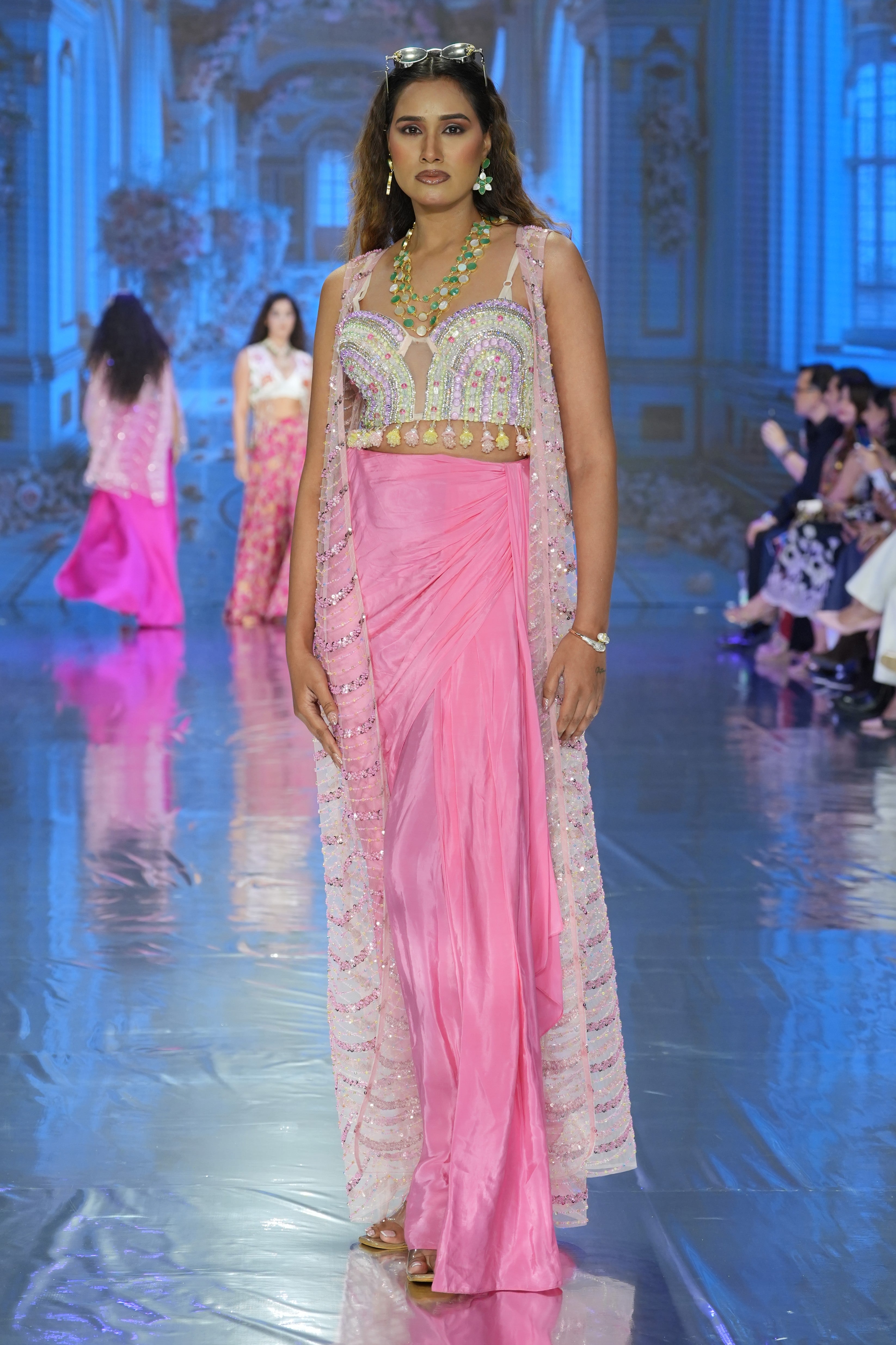 Pleated skirt with embroidered blouse and jacket