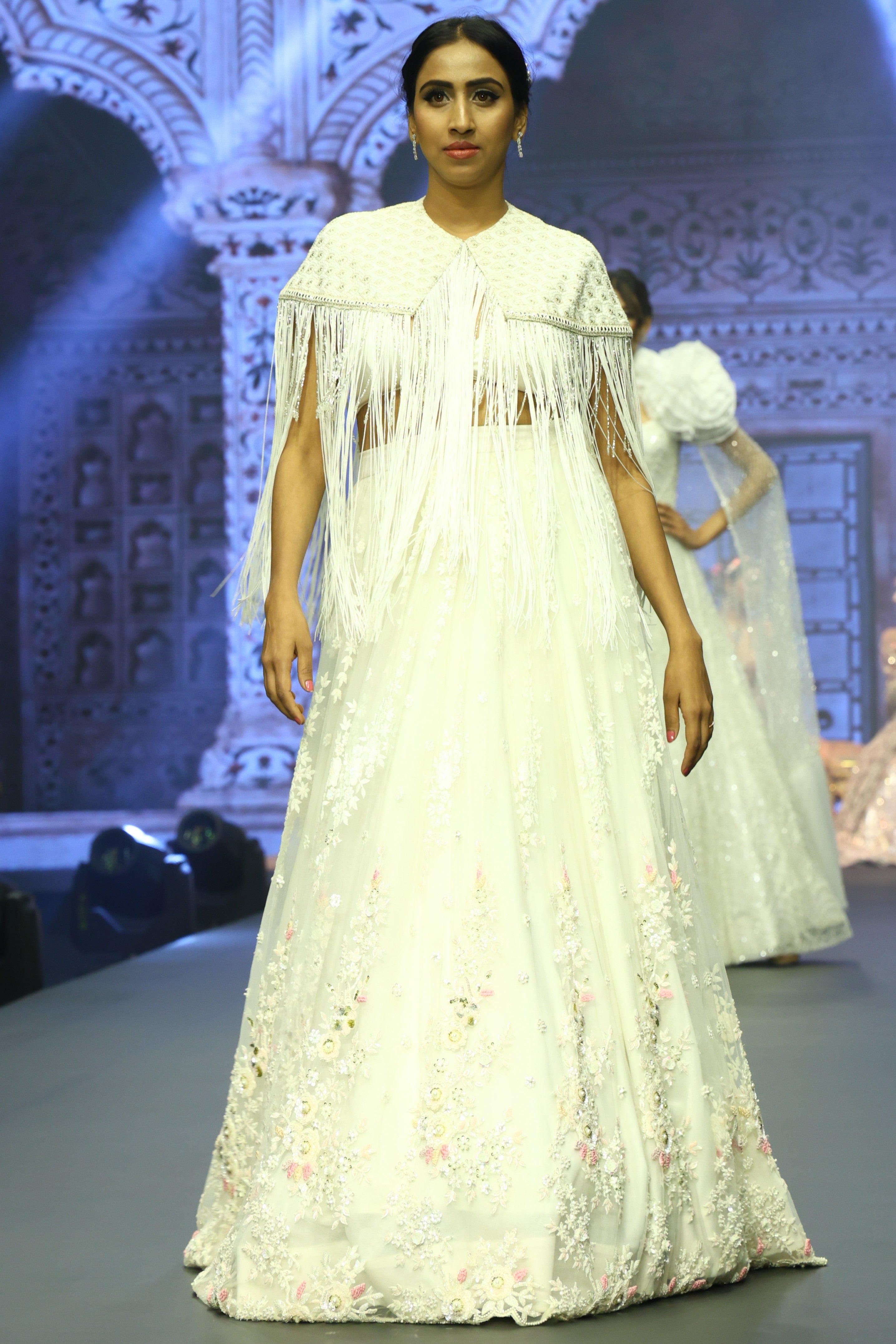 White sequin lehenga set with cape jacket