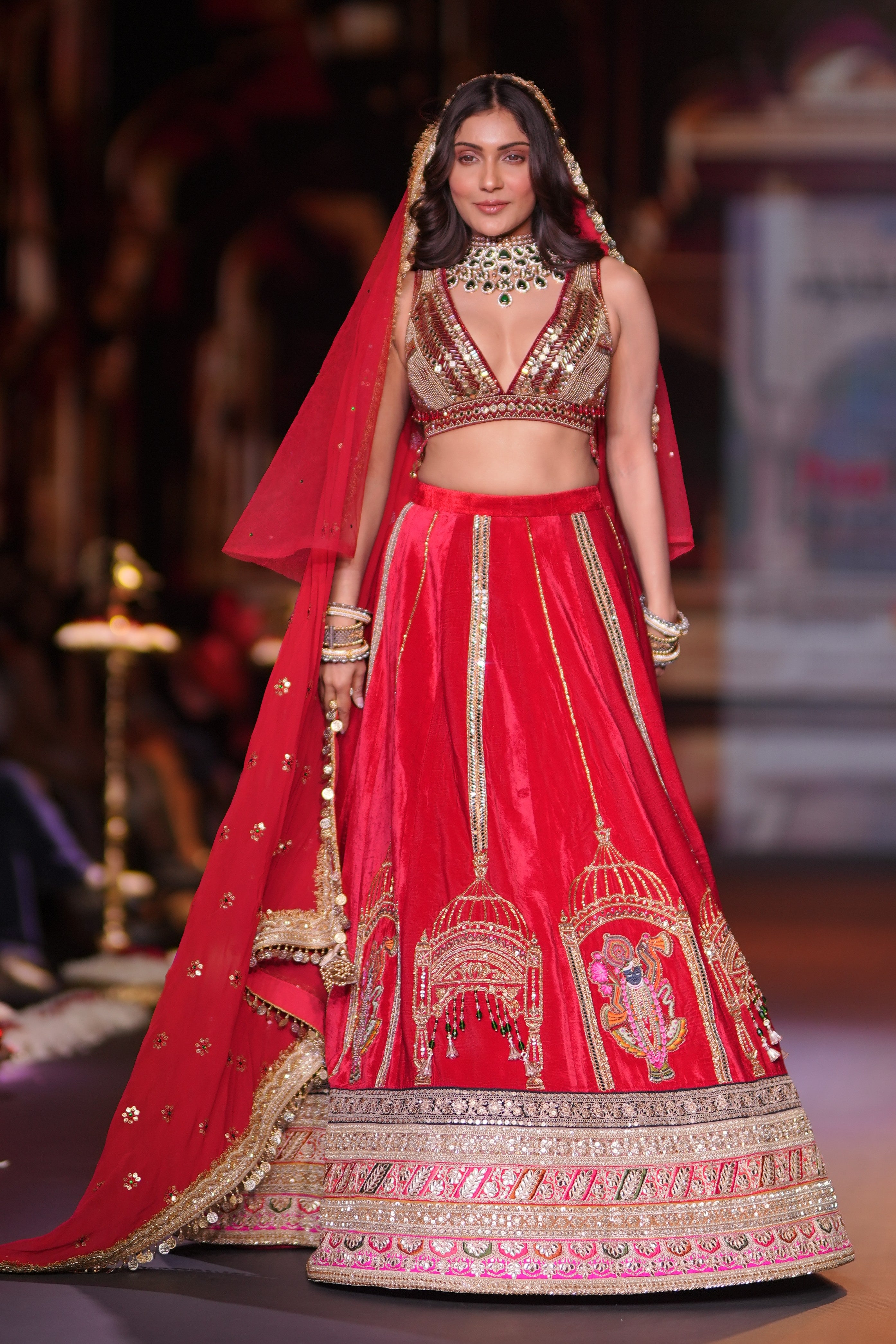 Red embroidered lehenga set with srinathji motif