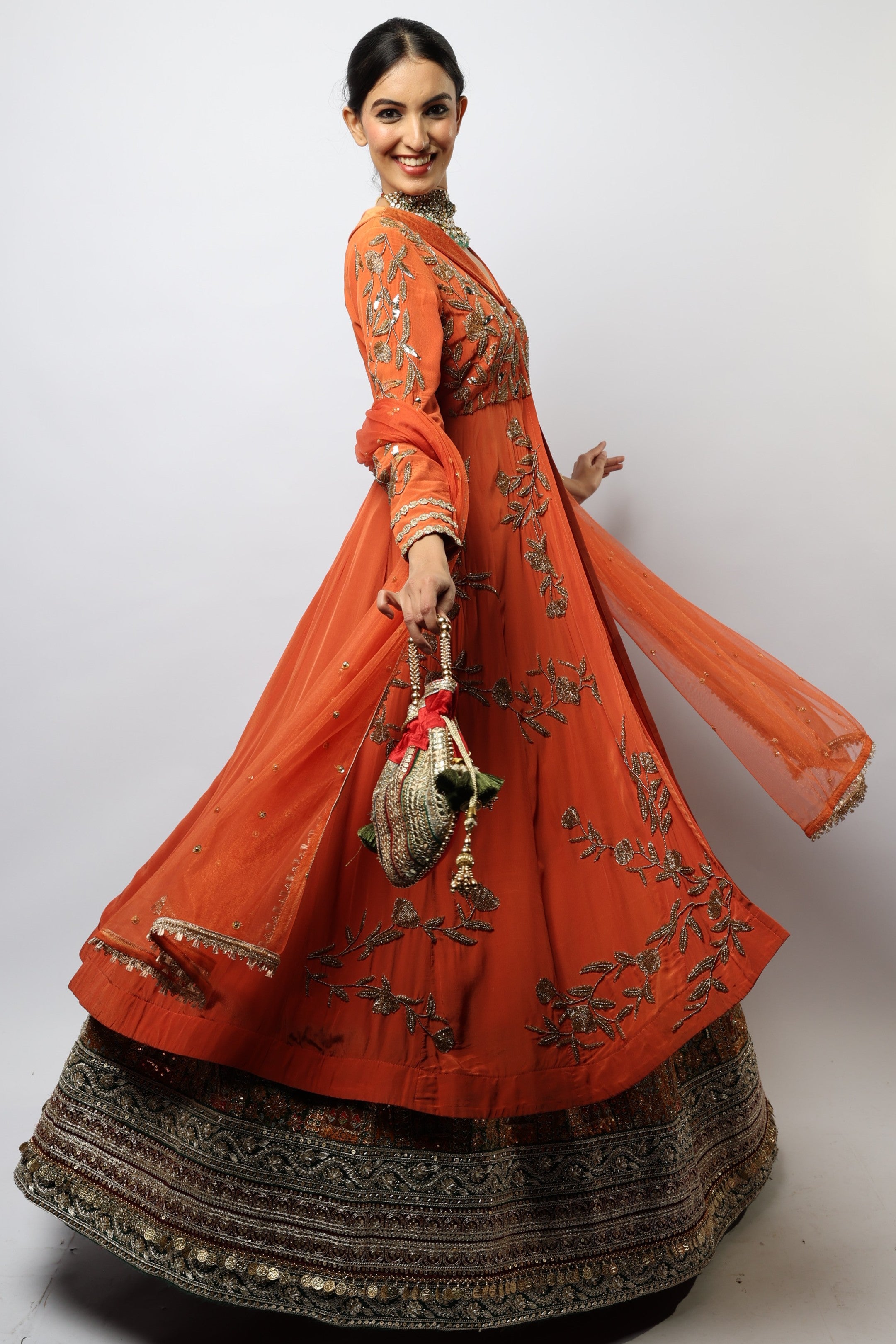 Orange kurta jacket and multi color embroidered lehenga set