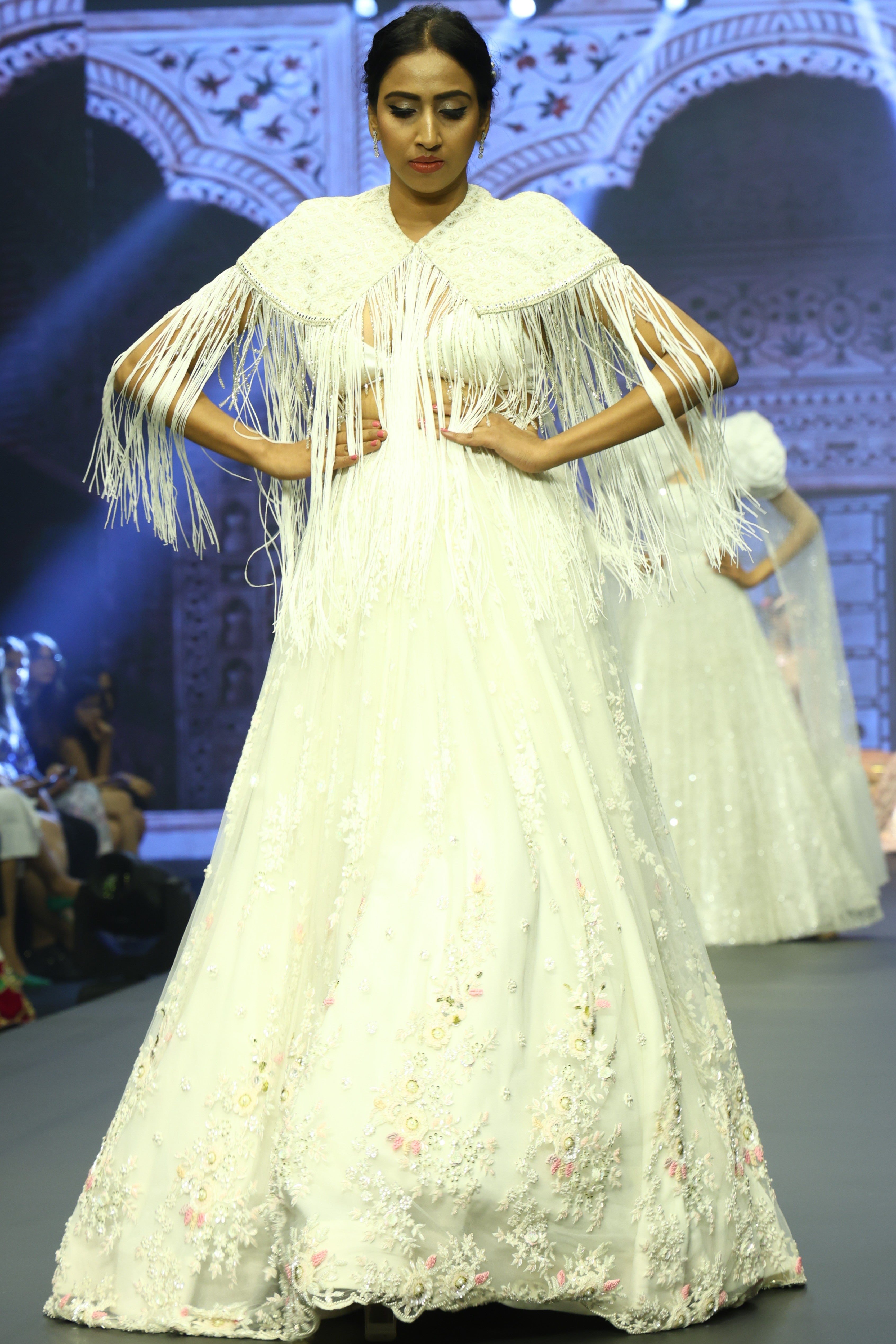 White sequin lehenga set with cape jacket
