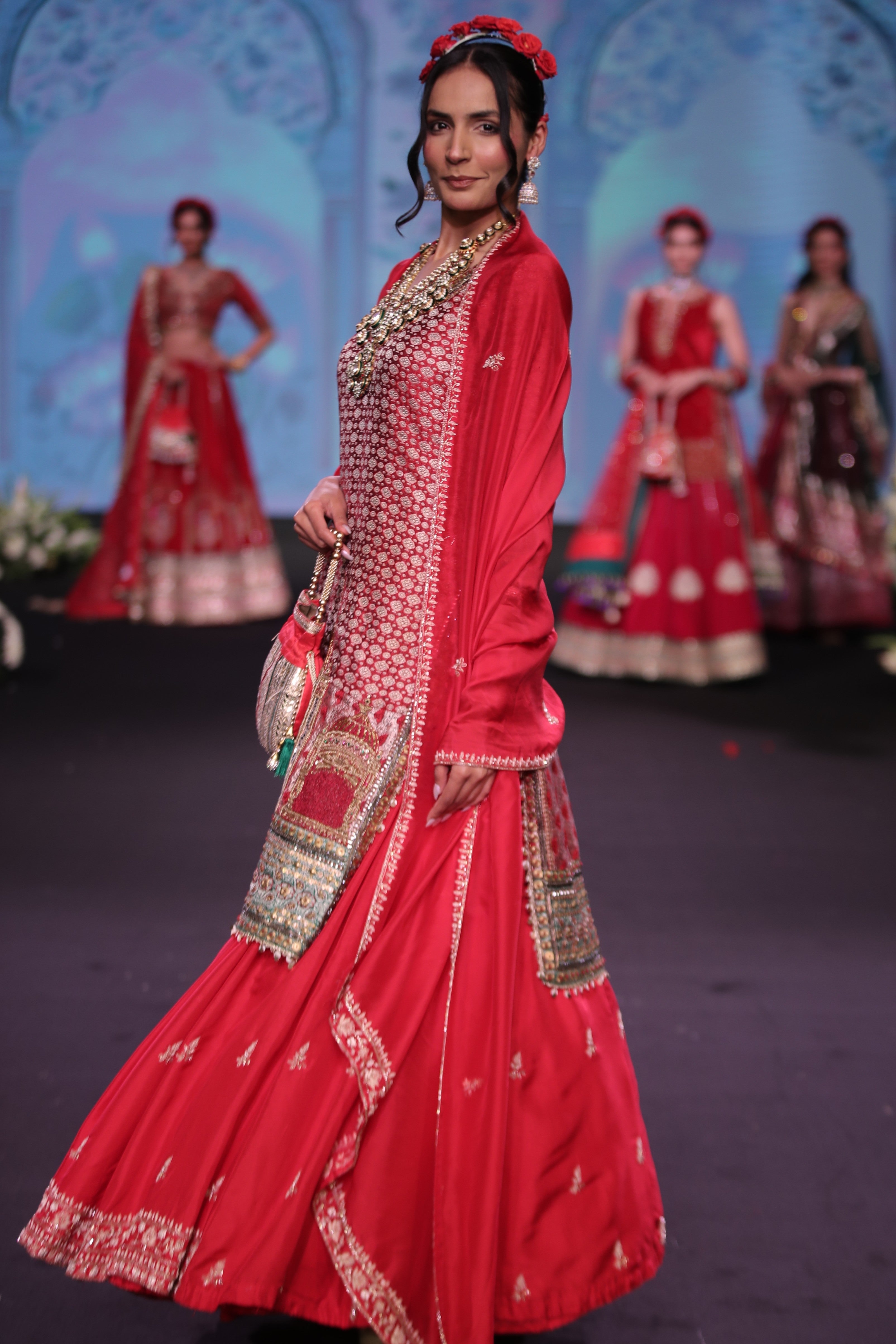 Red embroidered kurta and lehenga set with srinathji motif