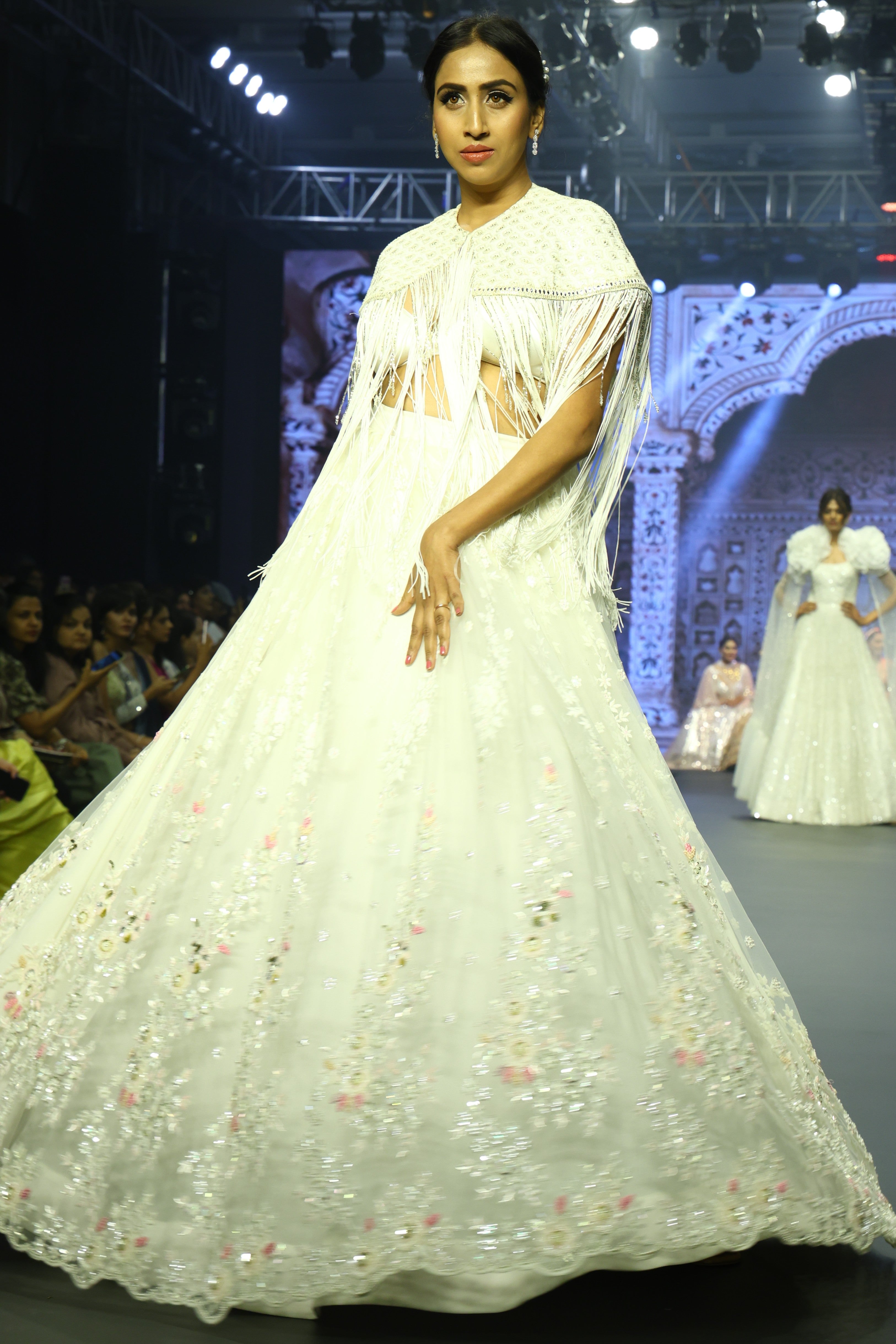 White sequin lehenga set with cape jacket