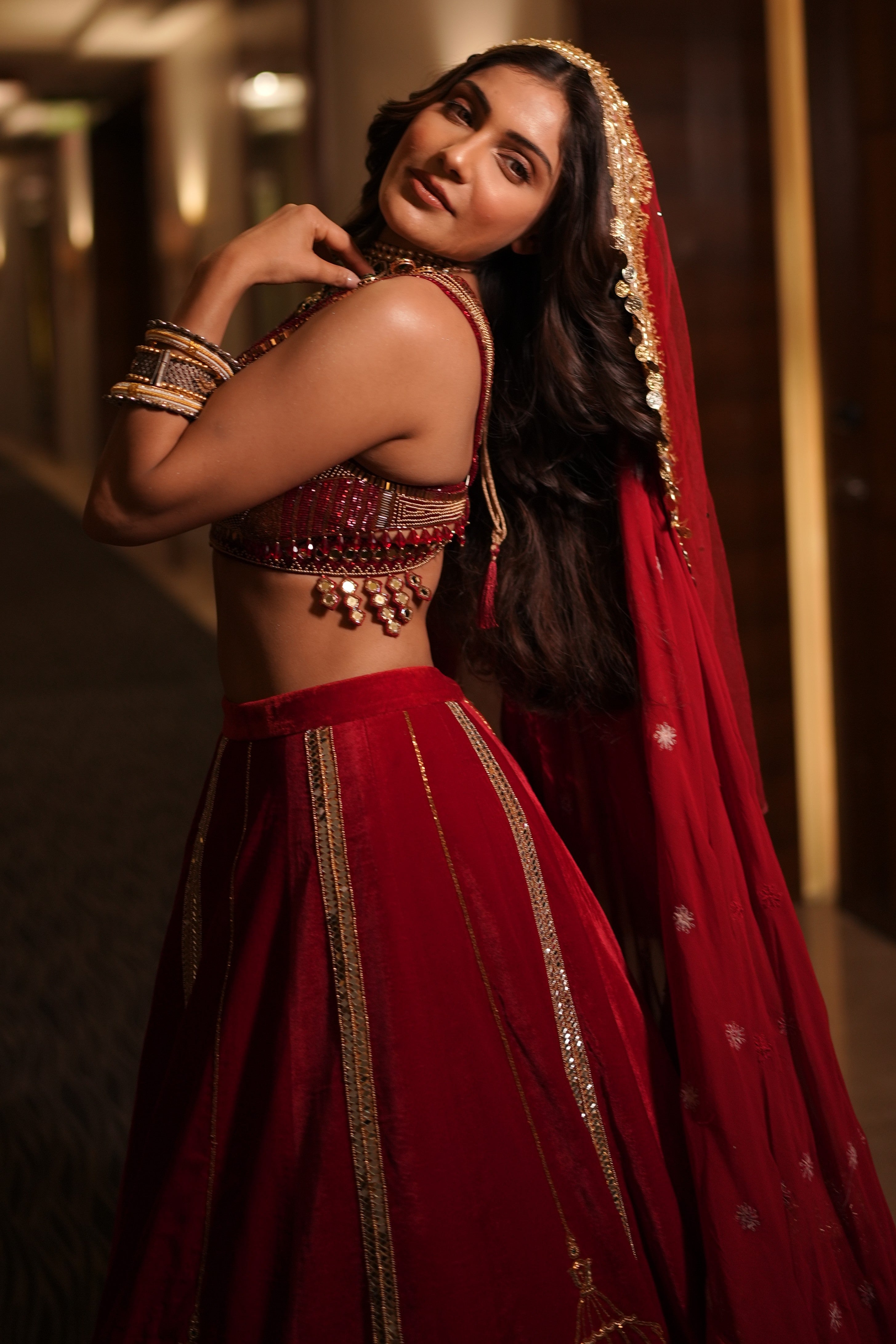 Red embroidered lehenga set with srinathji motif