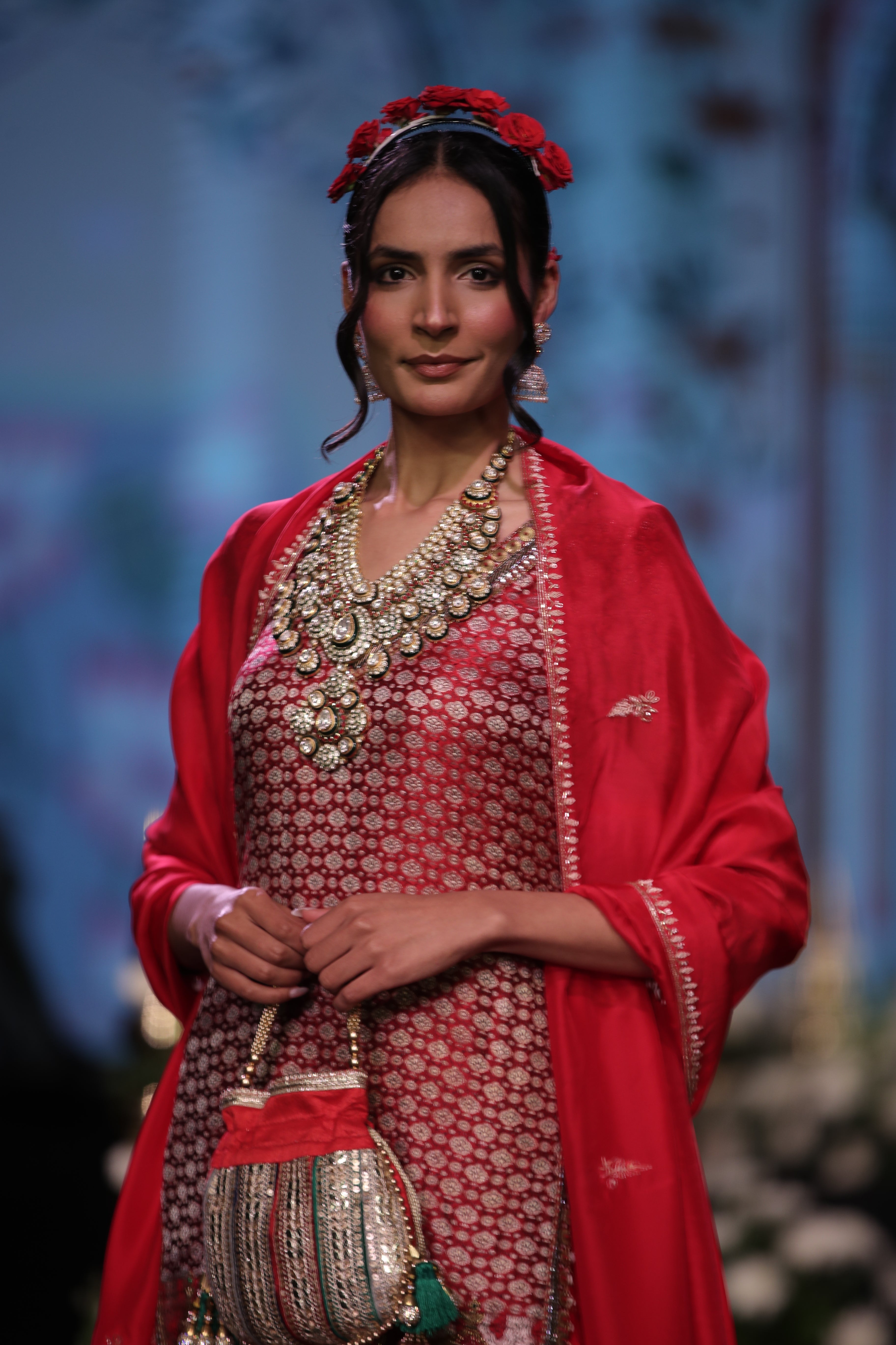 Red embroidered kurta and lehenga set with srinathji motif