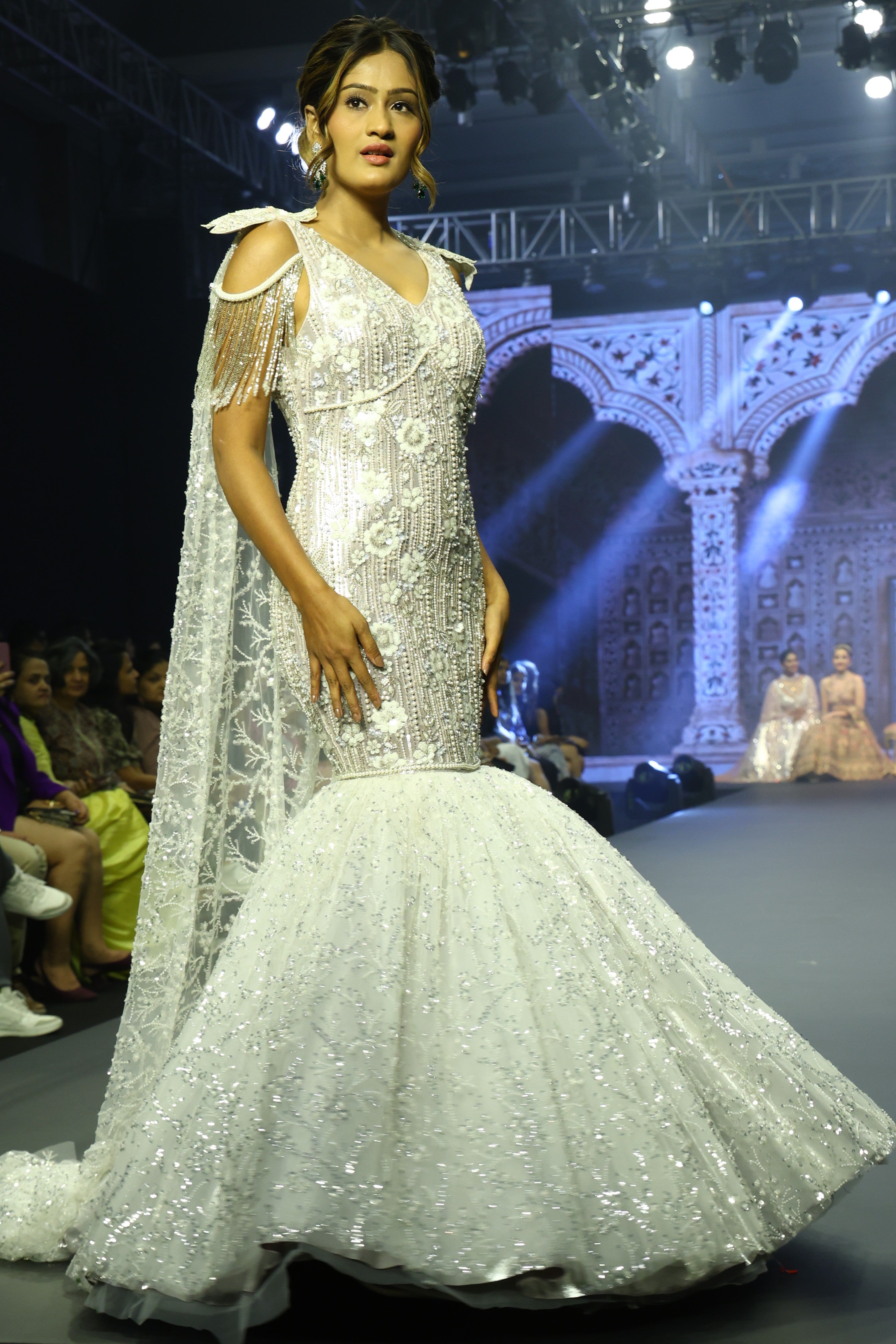 White mermaid cut gown with sequin embroidery