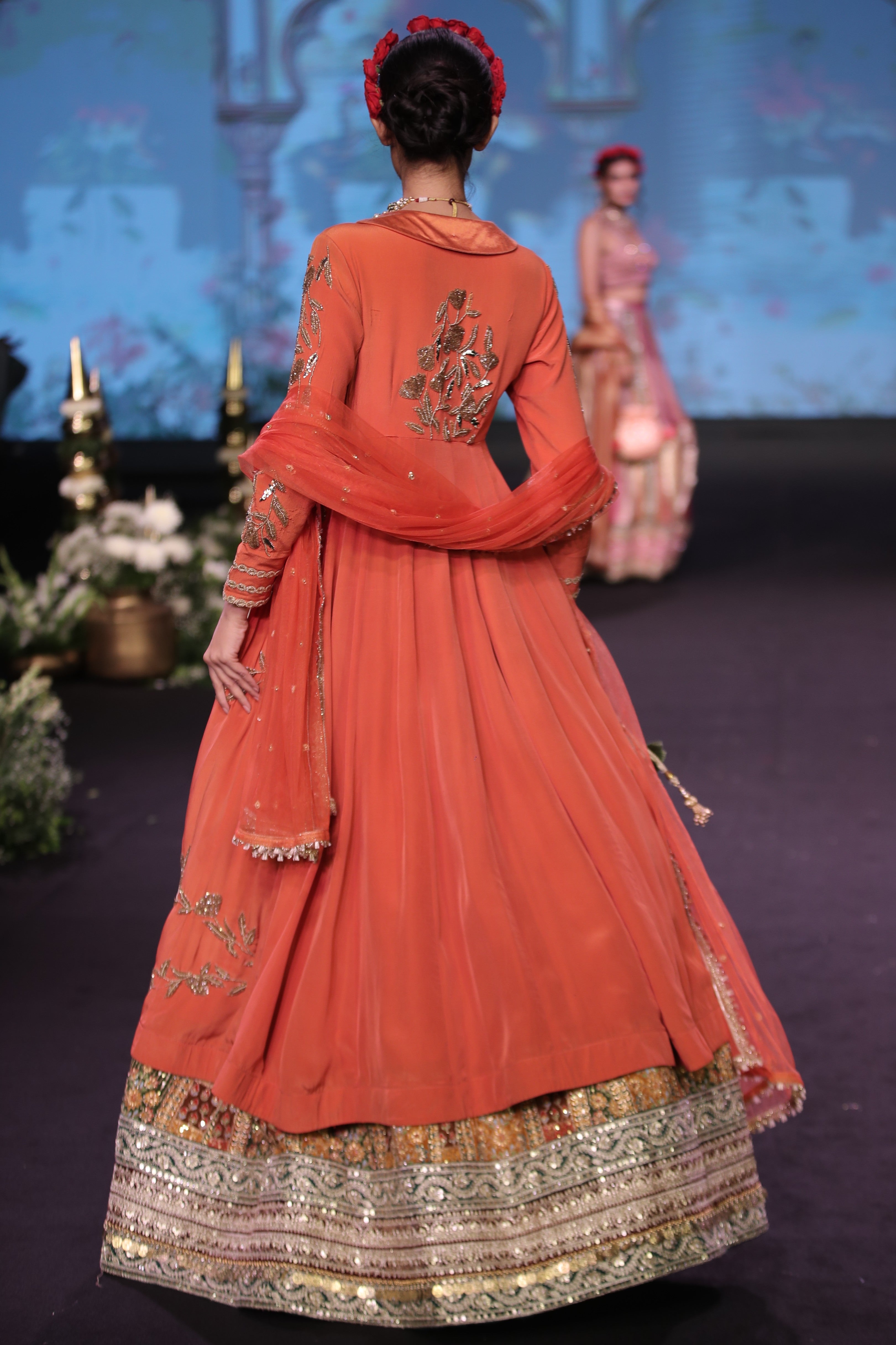 Orange kurta jacket and multi color embroidered lehenga set