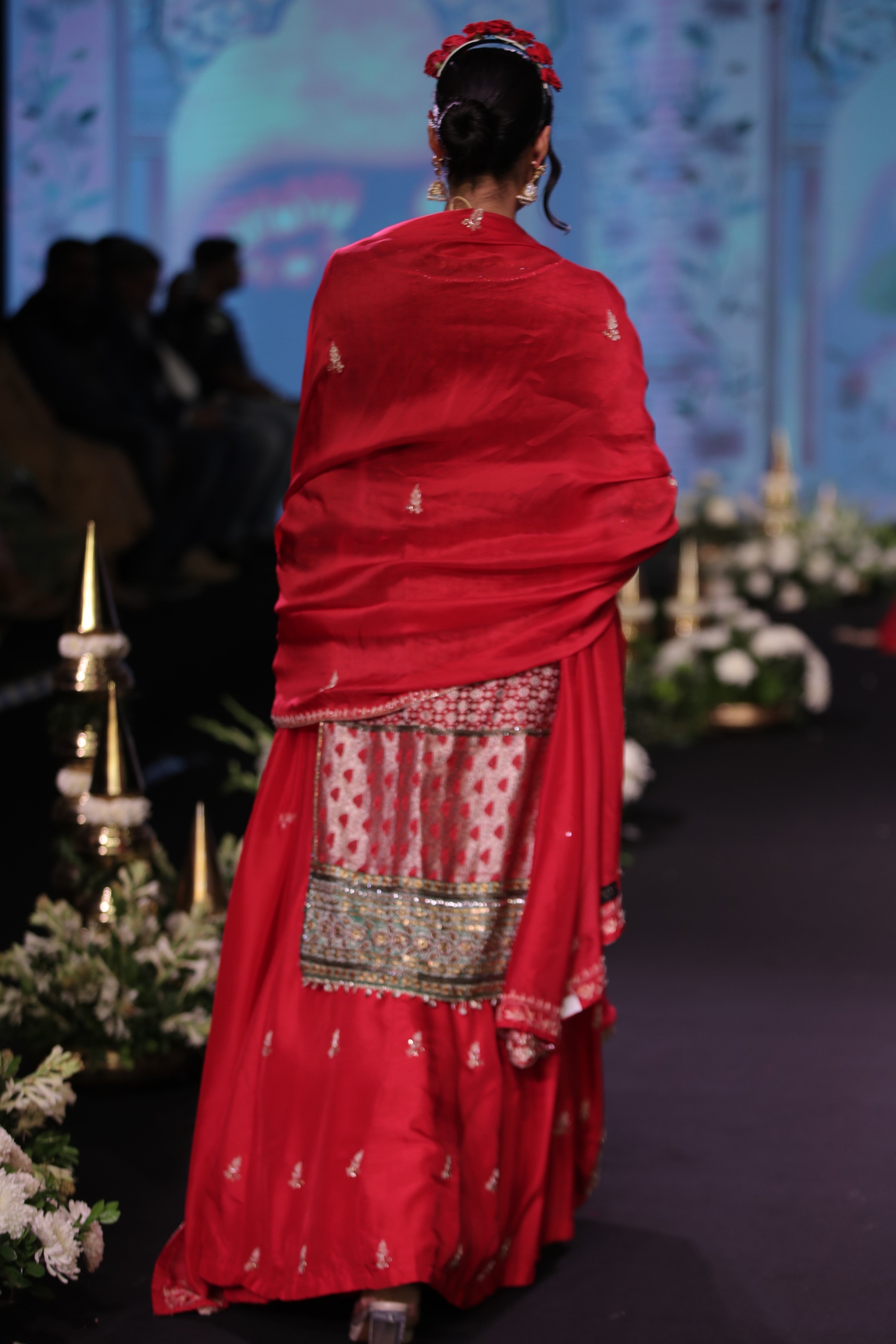 Red embroidered kurta and lehenga set with srinathji motif