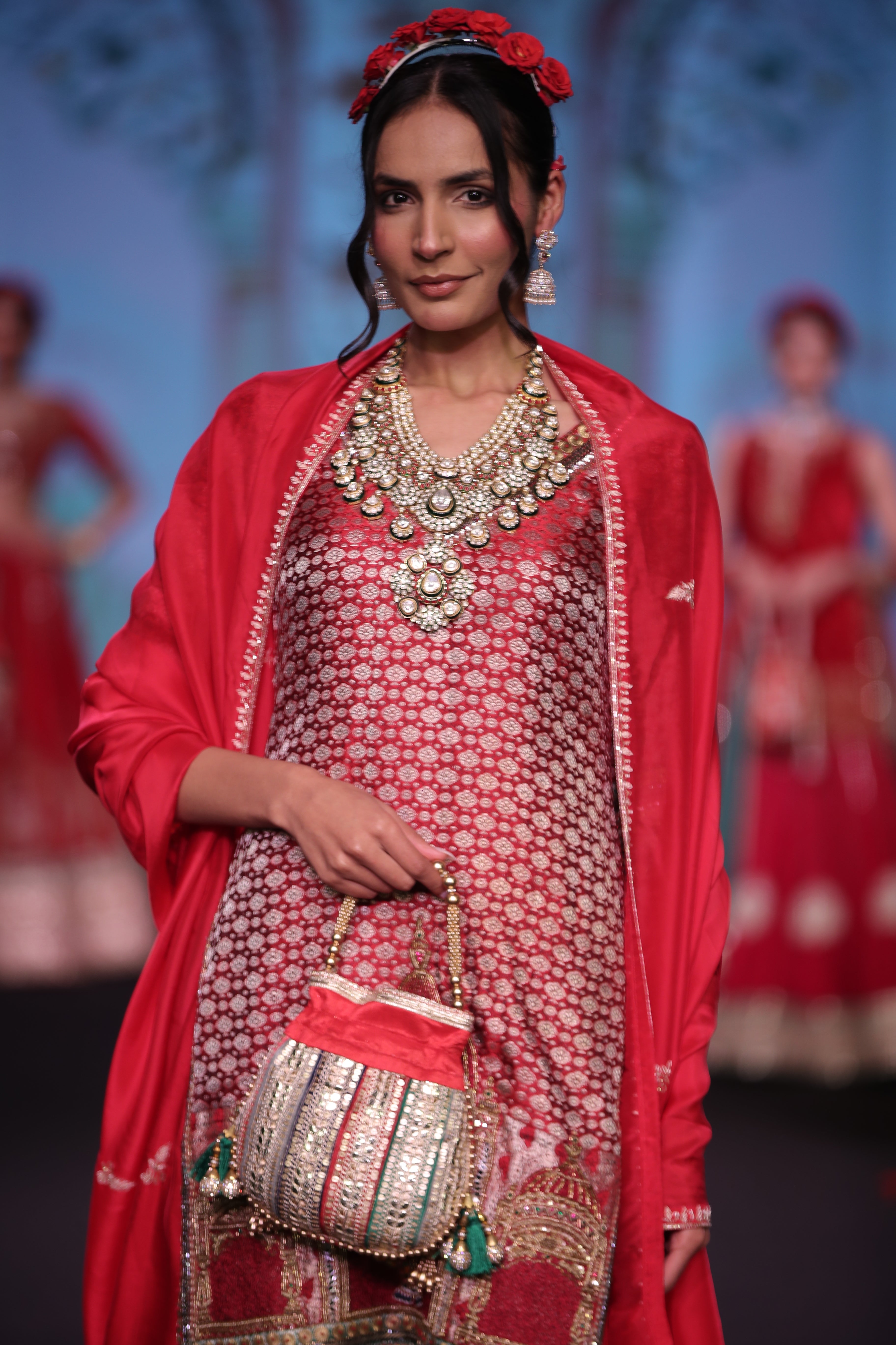 Red embroidered kurta and lehenga set with srinathji motif