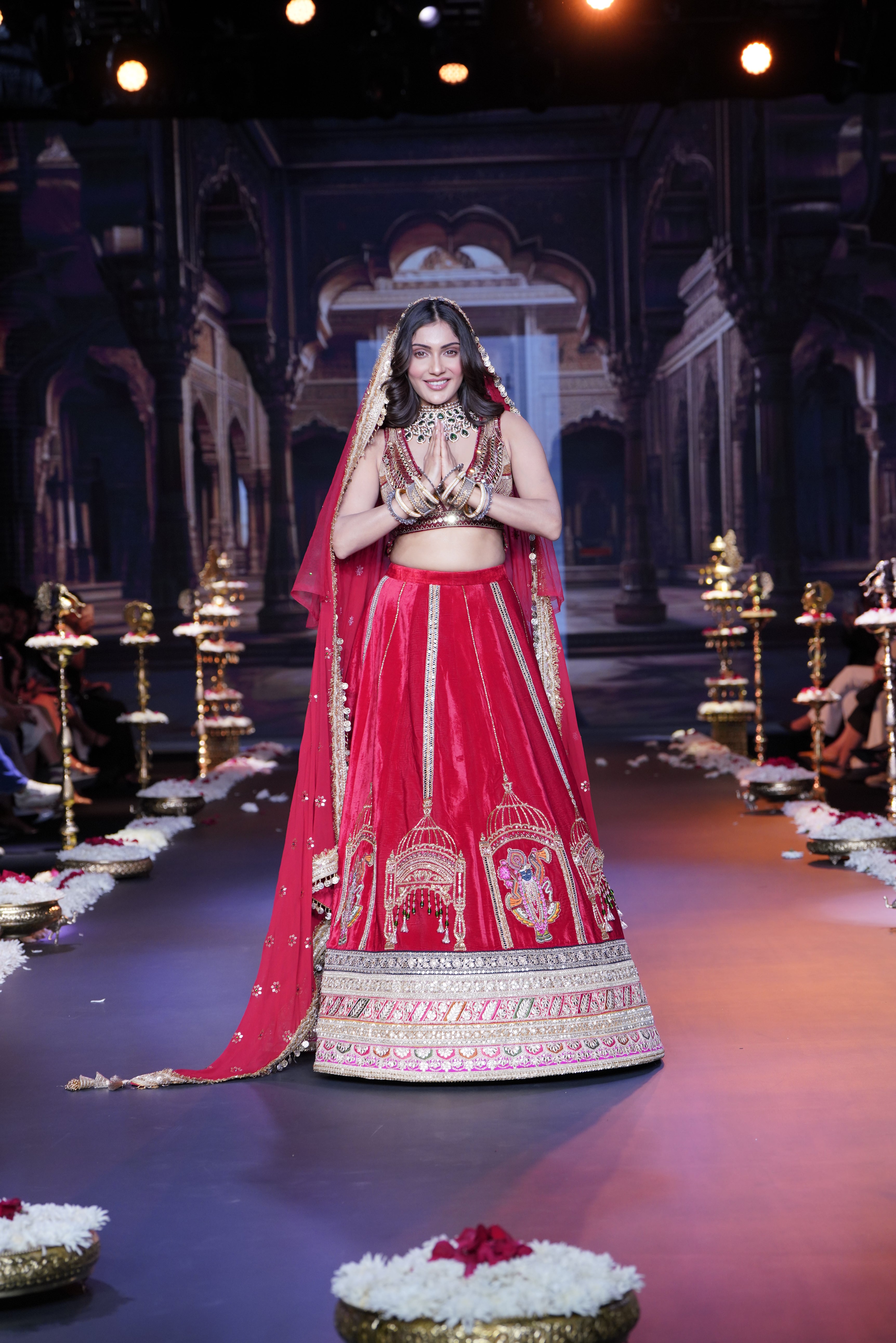 Red embroidered lehenga set with srinathji motif