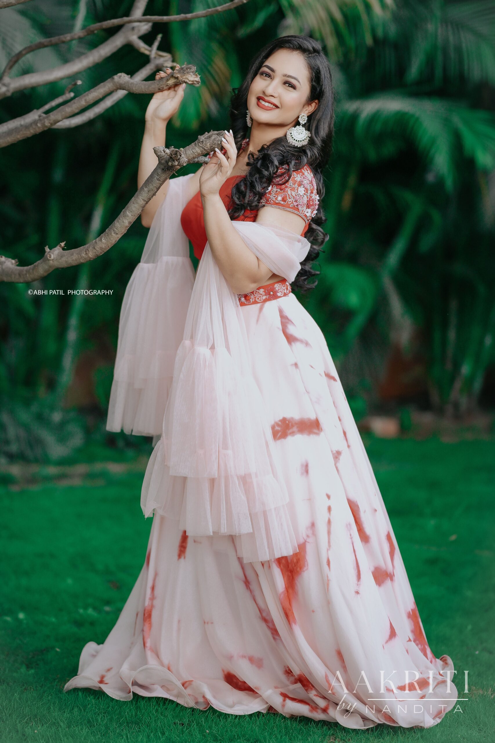 Girija Prabhu In Red Coloured Tie And Dye Lehenga